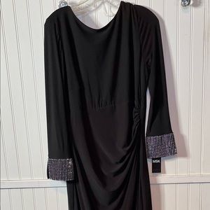 NWT full length black gown with side slit, v in back, rhinestones on cuffs